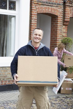 House movers preparing a London home move with boxes and furniture