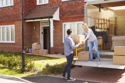 Professional packers organising boxes during a London home move