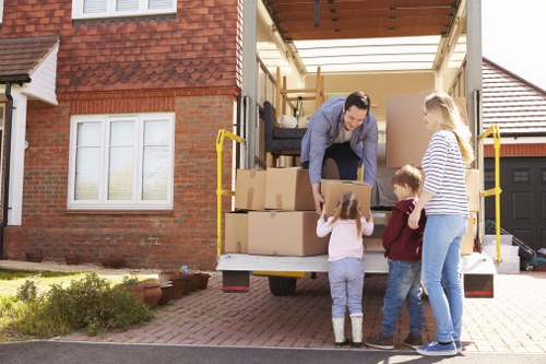 Man with van removing household items in a London street