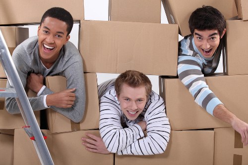 House removal company preparing furniture for safe moving