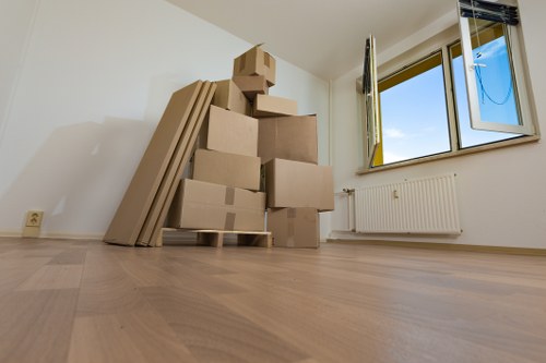 Furniture pick-up team removing a sofa from a London flat