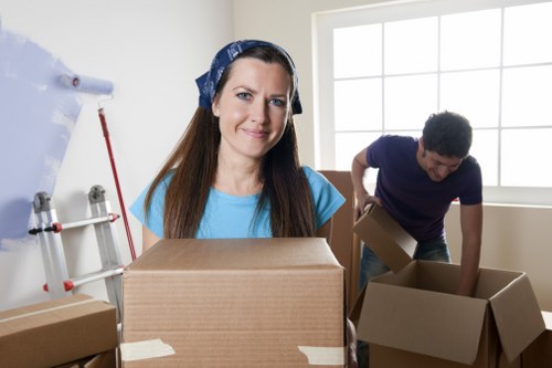 Packed office boxes and labelled items ready for a commercial relocation in London