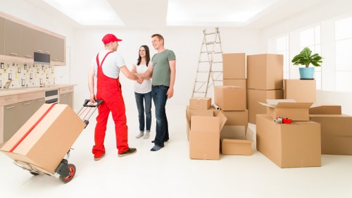 Packed moving boxes and furniture ready for transport in London