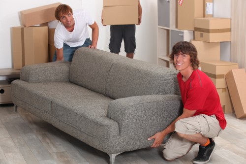 Loading furniture into a van on a London street