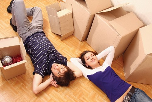 Packed furniture and protective wrapping prepared for a London move