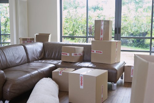 Office relocation scene with desks, boxes, and movers in London